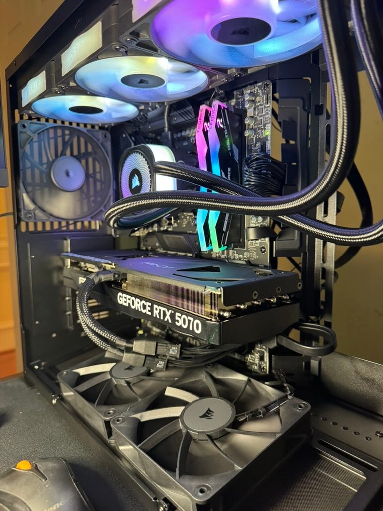 Graphics card and liquid cooling installed inside a custom PC build in progress